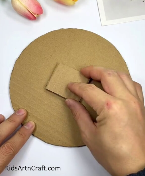 Pasting A Cardboard Piece- Making a Clock with Cardboard for a Recycled Kids Project