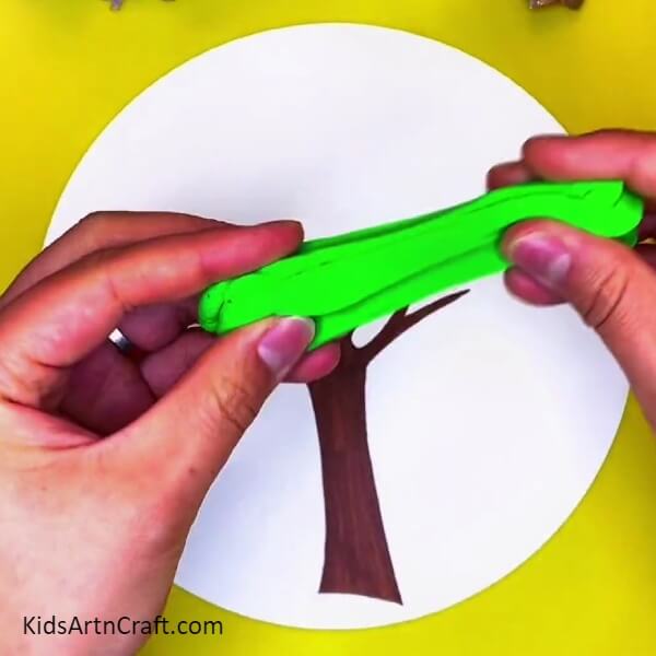 Taking Out A Piece Of Green Clay- How to Make a Love Tree Using Clay - A Guide for Children 