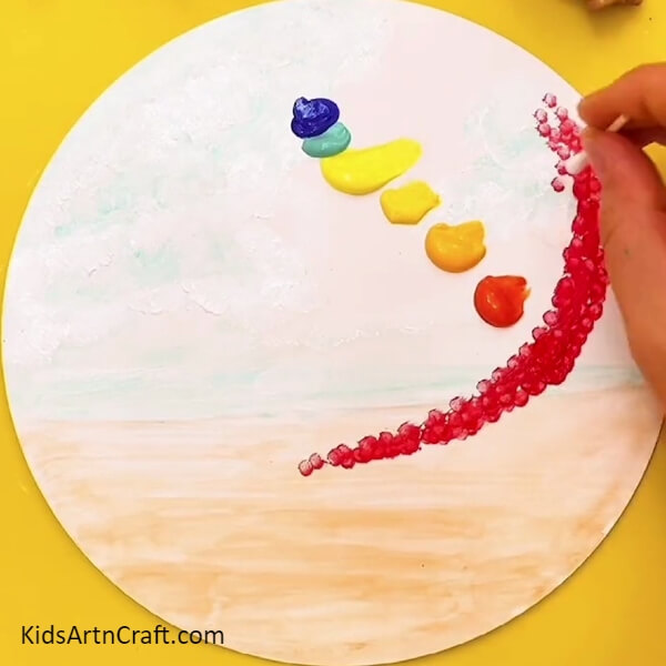 Painting with an ear bud- A colorful Tree for the fledgling painter