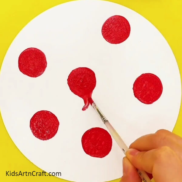 Bringing the Shape of the Red Turnips- A creative idea for kids to paint a peacock with their fingertips.