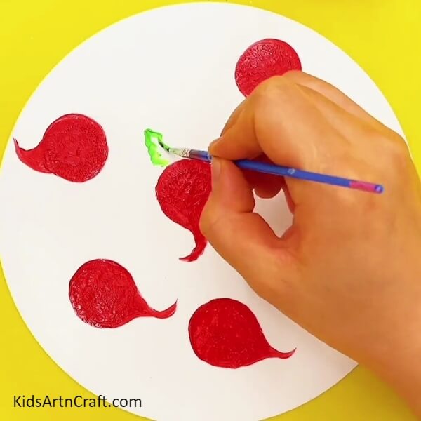 Painting the Leaves in the Red Turnips- A unique way for kids to paint a peacock: with their fingerprints.