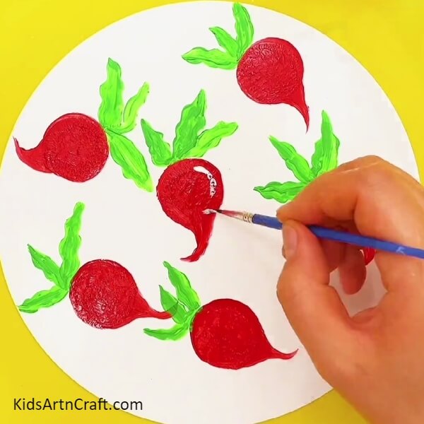 A Touch of White to the Red Turnips for Prominence- Kids can create a peacock masterpiece using their fingers.