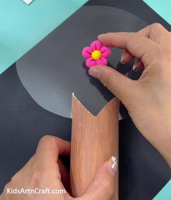 Placing flower in the transparent sheet- Form the Super-Clay Cherry Blossom Tree From a Toilet Paper Roll 