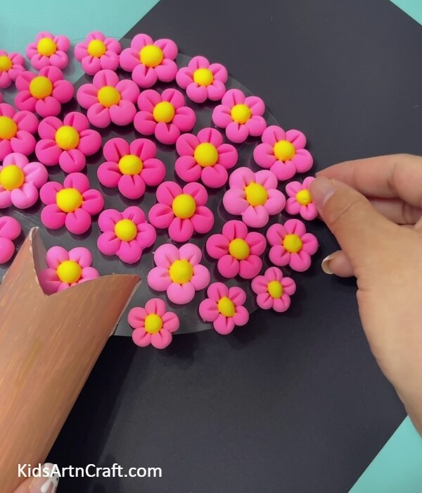 Keep on sticking more flowers - Making a Super-Clay Cherry Blossom Tree From a Toilet Paper Roll