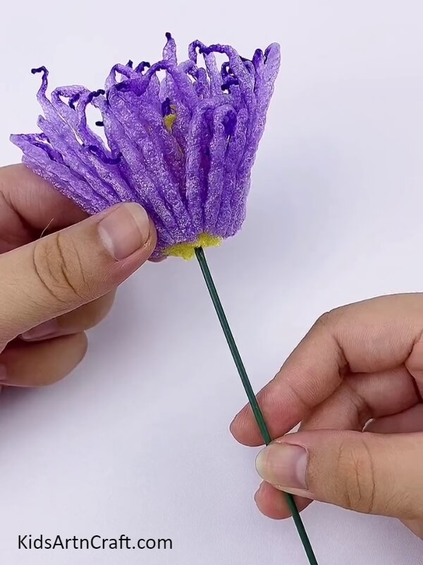 Make The Stem Of The Flower And Stick The Flower In It-
