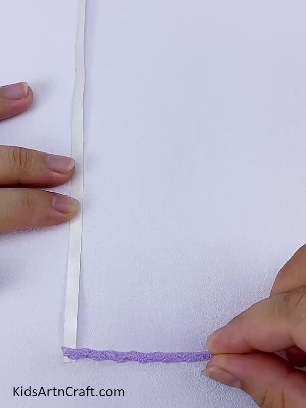 Take A White Paper Strip And Attach Strands To It-