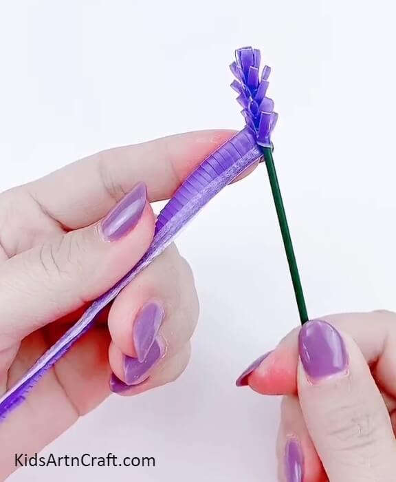 Rolling and pasting straw over green stick. Beautiful Lavender 3D Flowers Making Art Tutorial For Kids