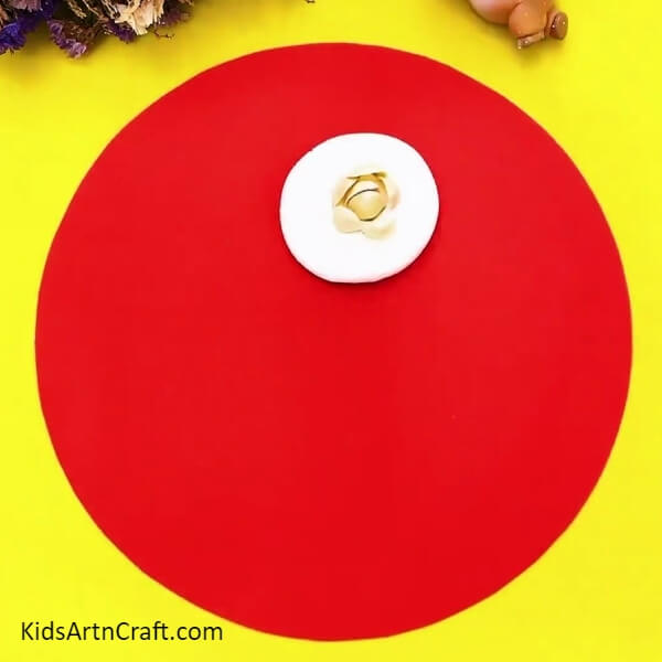 Continue To Stick The Shells In A Circular Pattern-An attractive Peanut Shell and Rose Garden Craft for kids