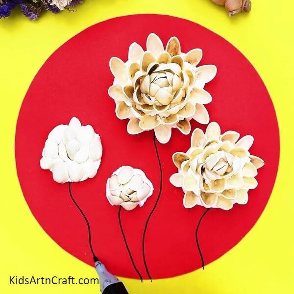 Draw Stems For The Flowers-A delightful Peanut Shell and Rose Garden Craft for children