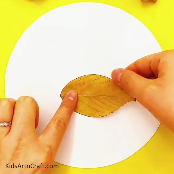 Pasting A Leaf Horizontally On Paper- Crafting a Swan Out Of Leaves For Novices