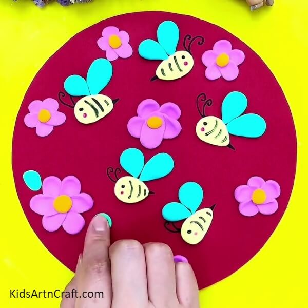 Adding Leaves And More Flowers-Pottery Crafting with Beeswax and Flowers - A Great Beginner Project