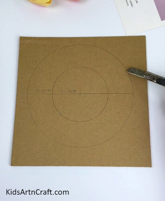 Drawing A Ring Of Measured Circles-An imaginative cardboard track for a ball and vehicle game craft concept.