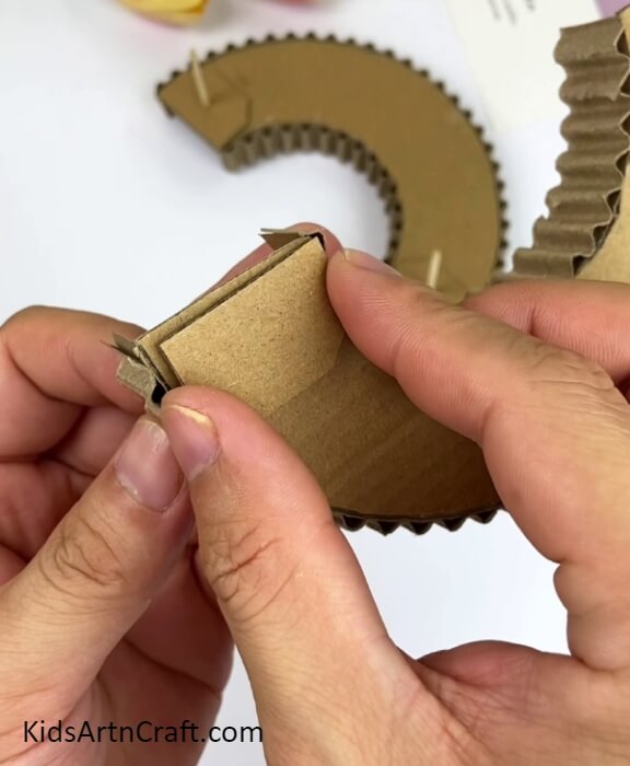 Placing The Hexagon Below The End Of The Ring Piece- An imaginative cardboard track for a ball and vehicle game craft concept. 