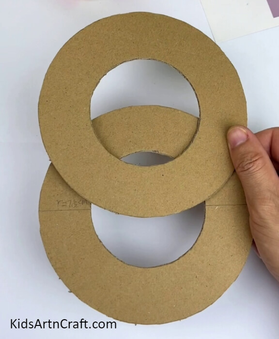 Cutting Out The Rings-Coming up with a fun cardboard course for a cars and balls game craft.