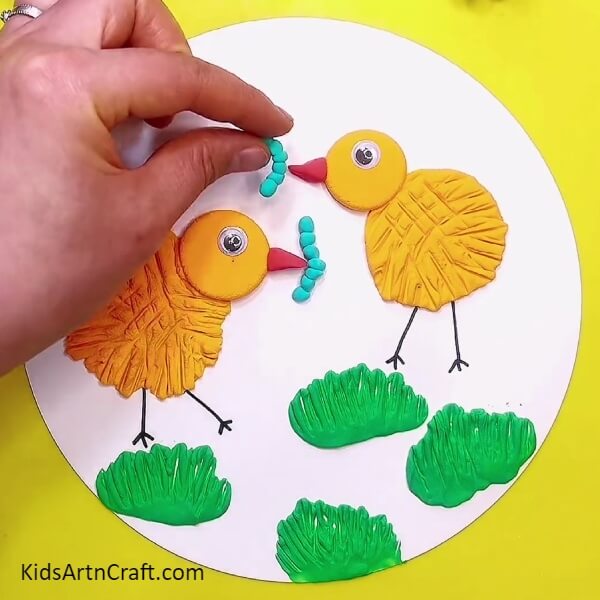 Pasting The Blue Balls Together-How to Make Clay Chick Designs – A Guide