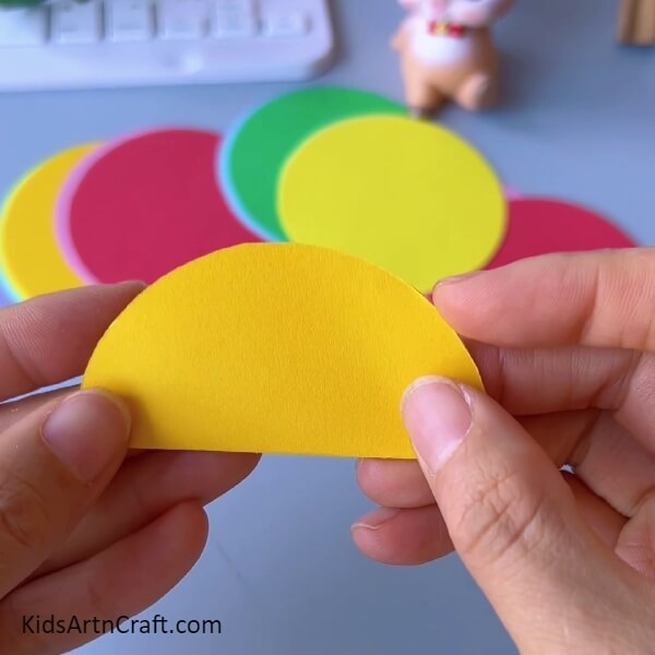folding a circle-complete procedure on to make a Colorful Paper Quarters for Kids