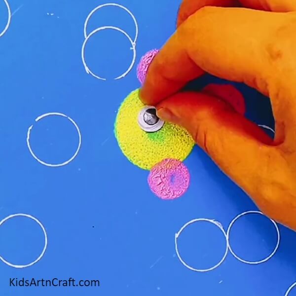 Pasting A Googly Eye- Making a colorful impression with stamping fish underwater art for kids. 