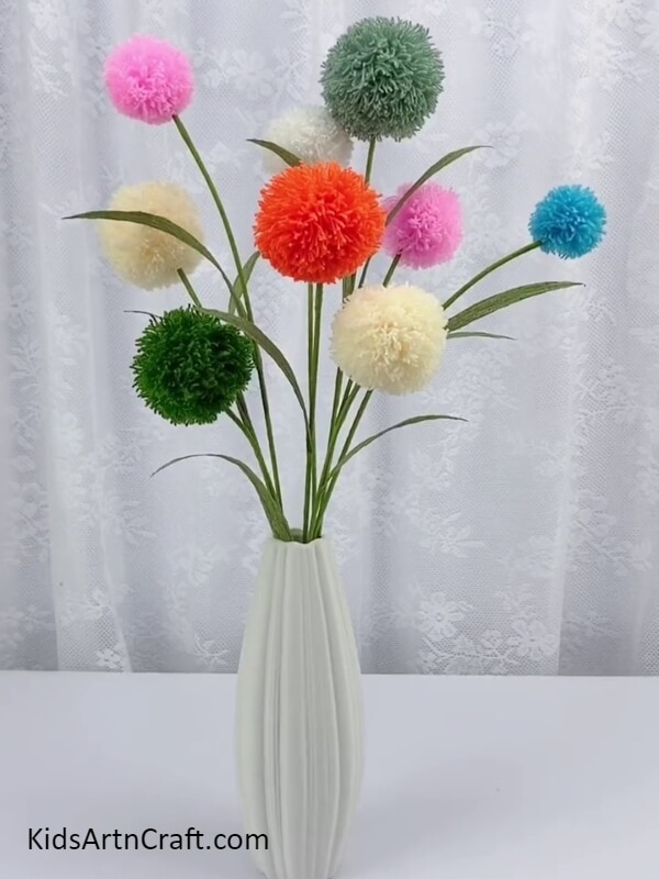 Finally, Your Craft Is Ready!!- Tutorial to assist children in making Pom Pom Flowers with an array of colors. 