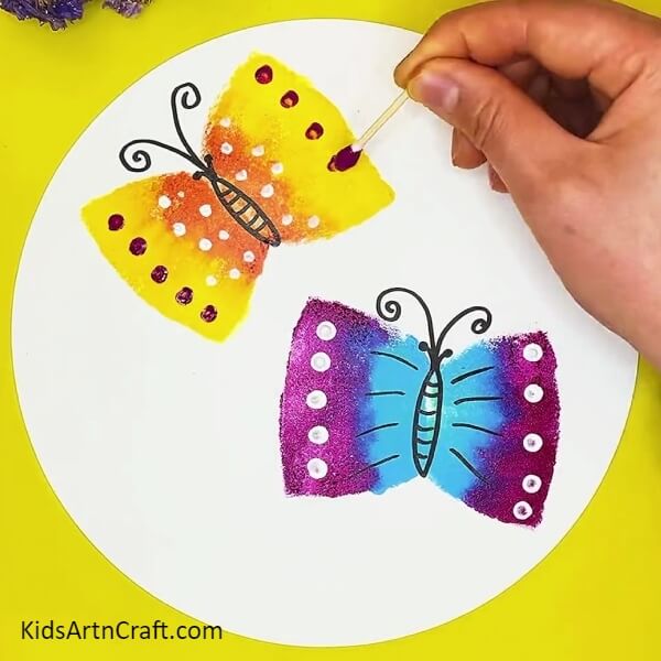 Stamping dots on butterfly. Creative Butterfly Painting Using Sponge Idea For beginners
