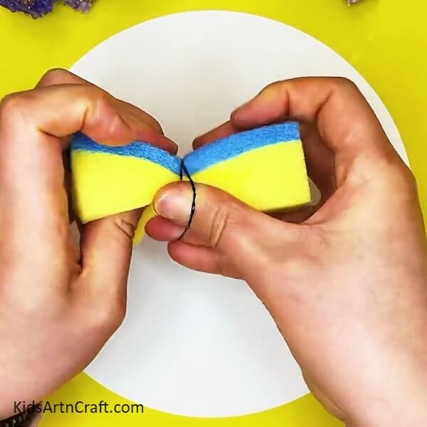 Tie the rubber on sponge. tutorial of creative Butterfly Painting For Kids