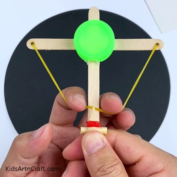 . A creative project of building a bow and arrow game with Popsicle sticks