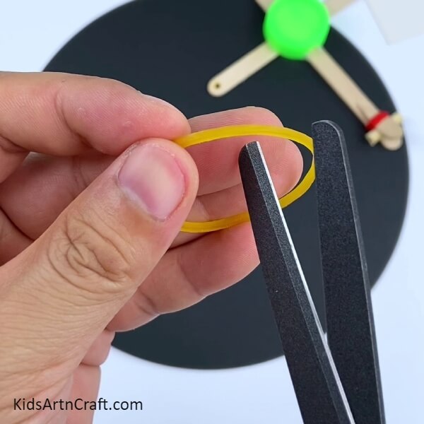 Designing a toy archery set with Popsicle sticks. 