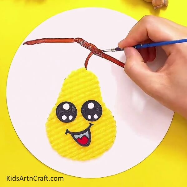 Drawing pear tree using brown paint- A step-by-step instructional guide on how to make an attractive Foam Pear craft with children.