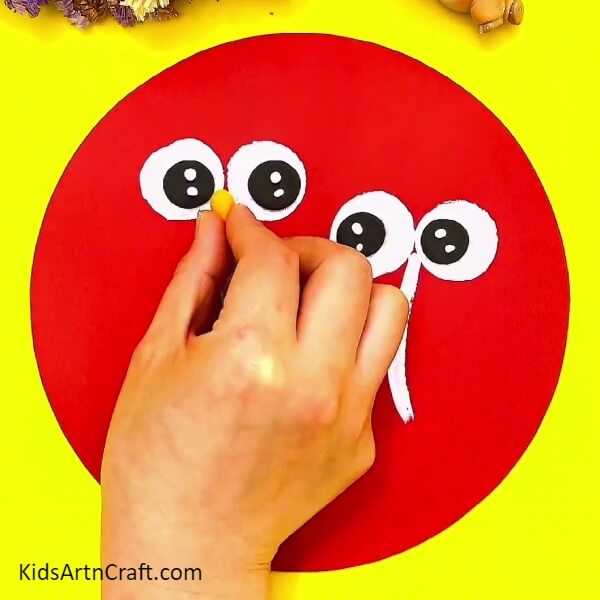Making nose with the orange colour clay- Clever Ostrich-Based Crafts with Clear Instructions