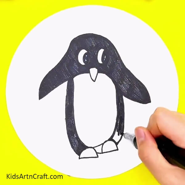 Coloring The Body Of The Penguin- An Instructional Guide To Paint a Pleasant Penguin Hand Outline For Children 
