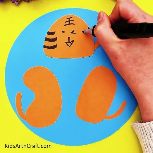 Drawing Face And Features Over The Body- Step-by-Step Directions for Crafting a Tiger with Paper 