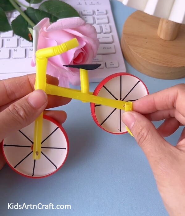 Completing The Cycle-Forming a Bicycle from a Paper Cup and a Plastic Straw