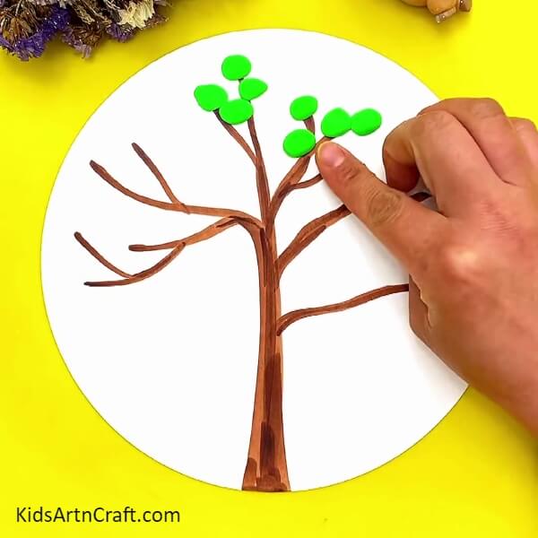 Make Circles With Green Clay And Stick Them On Branches-How to Make a Bird Tree with Clay