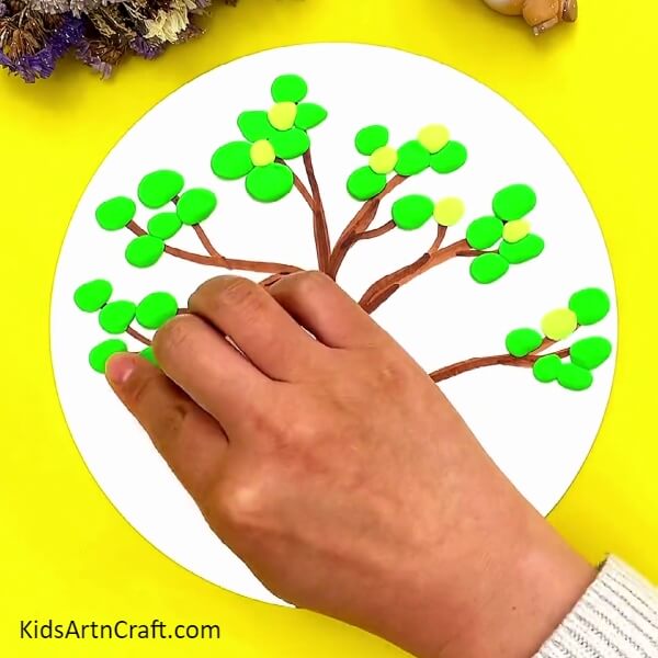 Make Circles With Yellow Clay And Stick Them On Branches-Do-it-Yourself Projects with Clay for Kids: A Bird on a Tree
