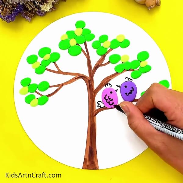 Make Features Of The Bird With A Black Marker/sketch Pen-Making a Tree with Clay Birds: A Tutorial for Kids