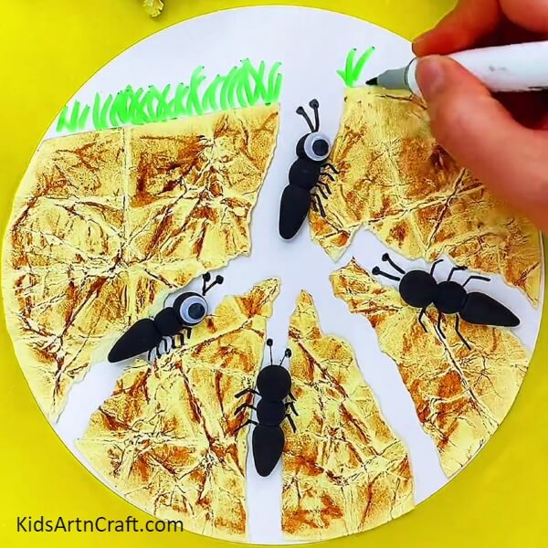 Draw Some Grass On The White Sheet-Generating a Do-It-Yourself Ant Artwork with Balled Up Paper for Kids