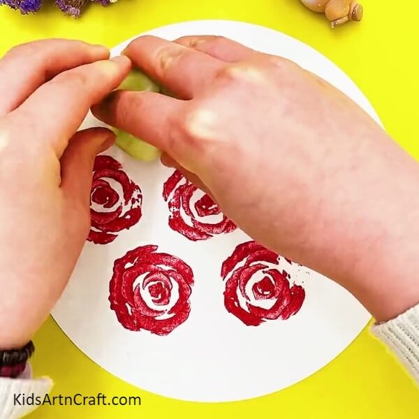 Make more stamps of red poster colour on white craft paper- Newbies Making a Rose Picture with a Lettuce Stamp