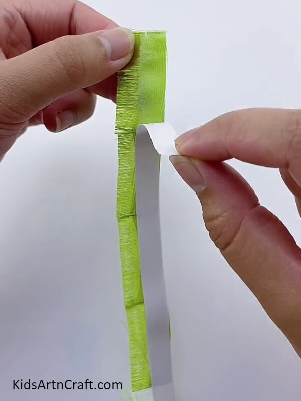 Let's remove the liner of the tape- A Guide for Creating Ribbon Flowers from Start to Finish