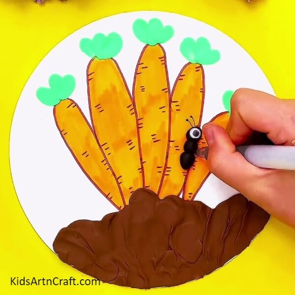 Draw the antennae and legs of the ant- An Effortless Tutorial on Cultivating Carrots with Artistic Crafts