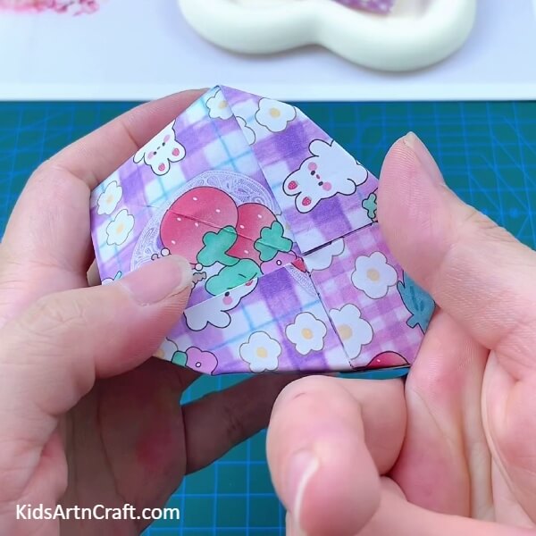 Giving The Figure A 3D Shape-Learn how to make a miniature origami paper holder with this step-by-step guide