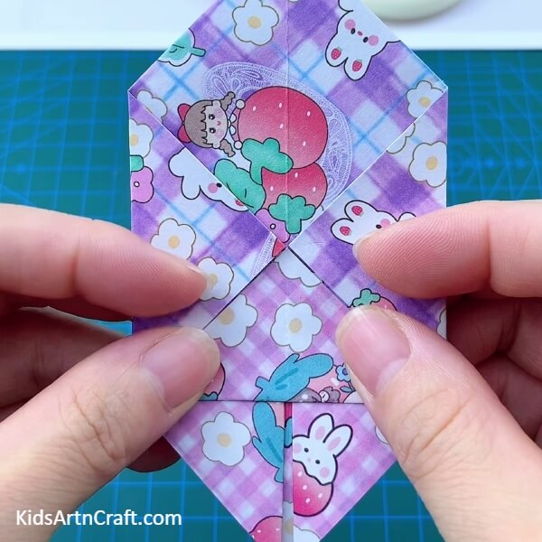 Folding The Bottom Corner-Try this tutorial to craft your own mini origami paper holder
