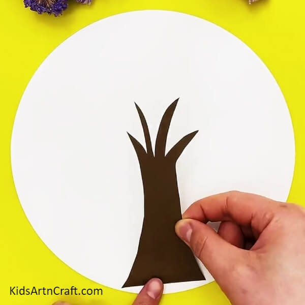 Take a brown craft paper and make a tree trunk- A guide on how to make a paper circle apple tree craft simply