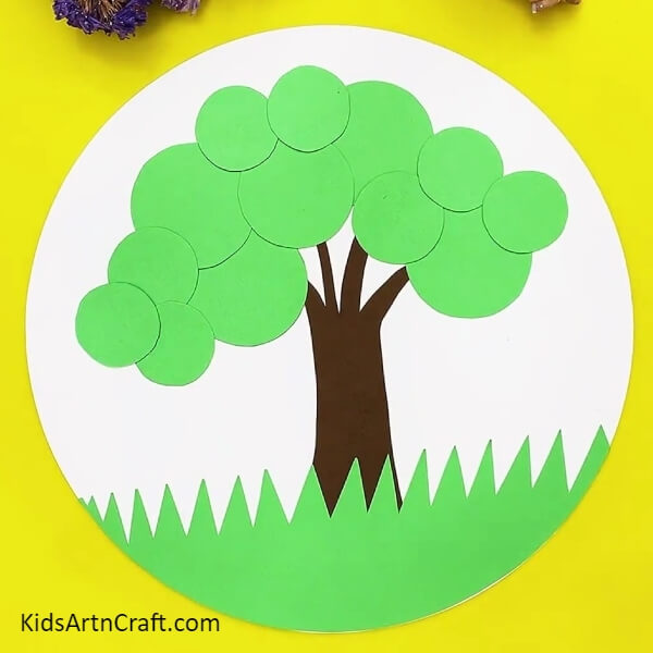 Stick more green circles with glue- A step-by-step guide to building a paper circle apple tree craft