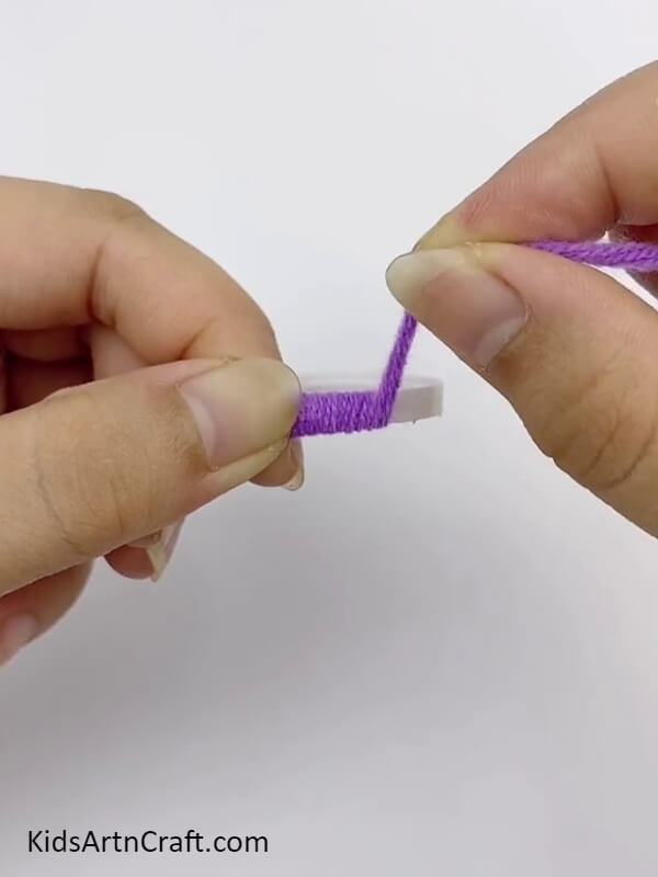 Wrap A Purple Yarn Around The Plastic Bottle Ring- Utilizing fruit foam and chopsticks to make a beautiful wall hanging. 