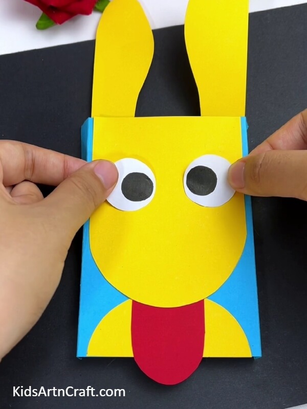 Attaching The Eyes Of The Dog- Learn How to Create a Paper Dog Toy - Step by Step