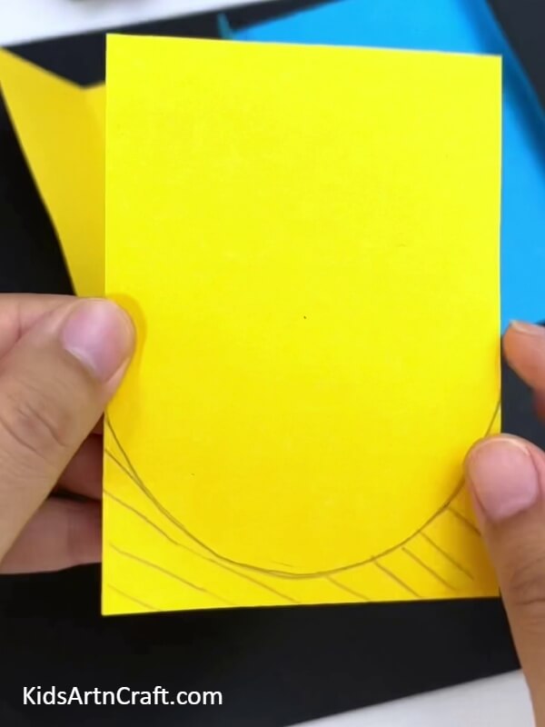 Drawing On The Yellow Paper-Step-By-Step Process for Crafting a Fun Dog Toy Out of Paper
