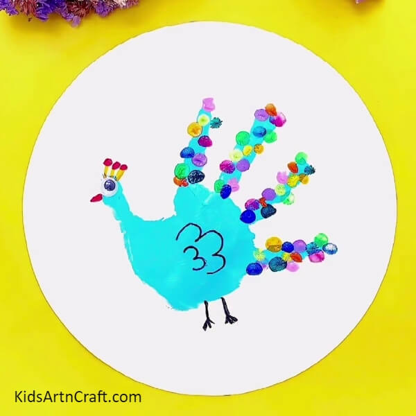 Your Artwork Is Ready- A handprint peacock painting – a great art project for the beginner.