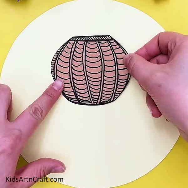 Stick The Plant Pot Template On White Craft Paper- Tutorial on Crafting Plant Pots for Children 