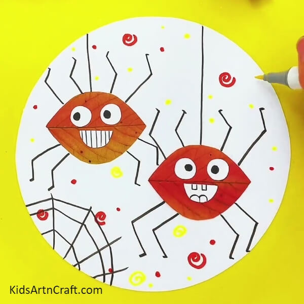 Adding Some More Details -Crafting Spiders from Leaves Kids Art Activity
