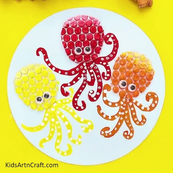 Painting Remaining Two Octopus And Pasting Googly Eyes- Step-by-step guide to making an octopus craft out of bubble wrap for children
