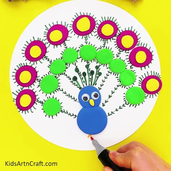 Drawing Our Peacock's Feet-Tutorial on making a clay peacock for children